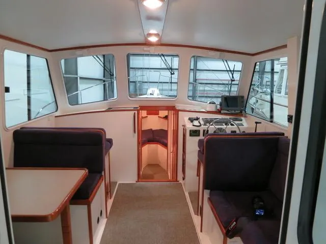 Slide: The Image of Interior of 2001 Northern Bay 36 boat with seating and navigation area. - 14