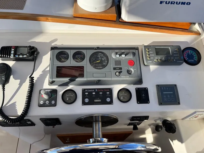 Slide: The Image of Control panel of a 2001 Northern Bay 36 boat with navigation and communication equipment. - 16