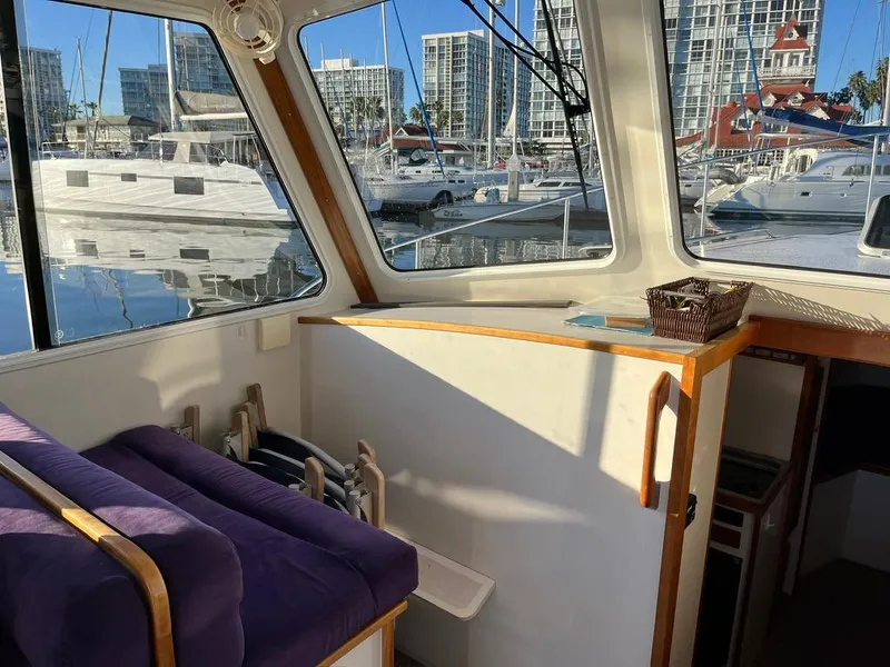 Slide: The Image of Interior view of a 2001 Northern Bay 36 boat with marina backdrop. - 21