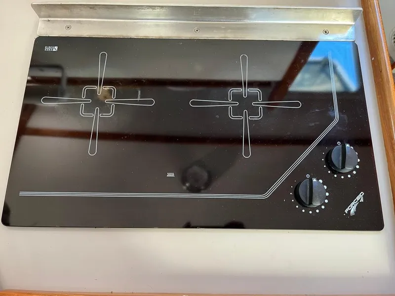 Slide: The Image of Ceramic cooktop with two burners and control knobs on a 2001 Northern Bay 36 boat. - 27