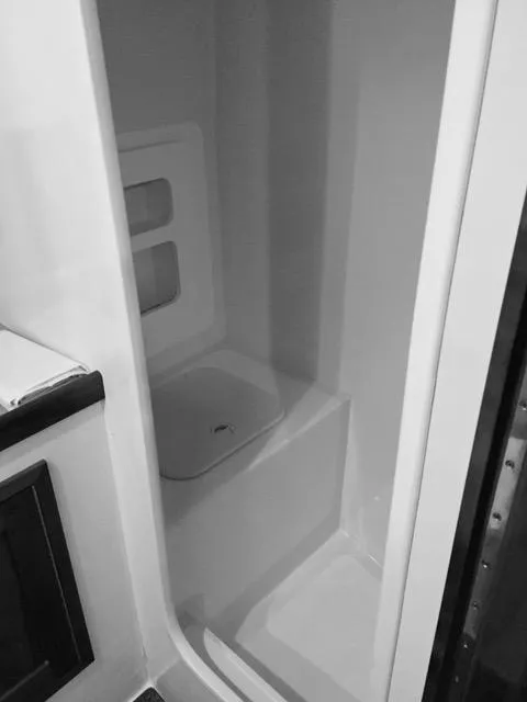 Slide: The Image of Interior shower of 2001 Northern Bay 36 boat, featuring sleek, compact design. - 32