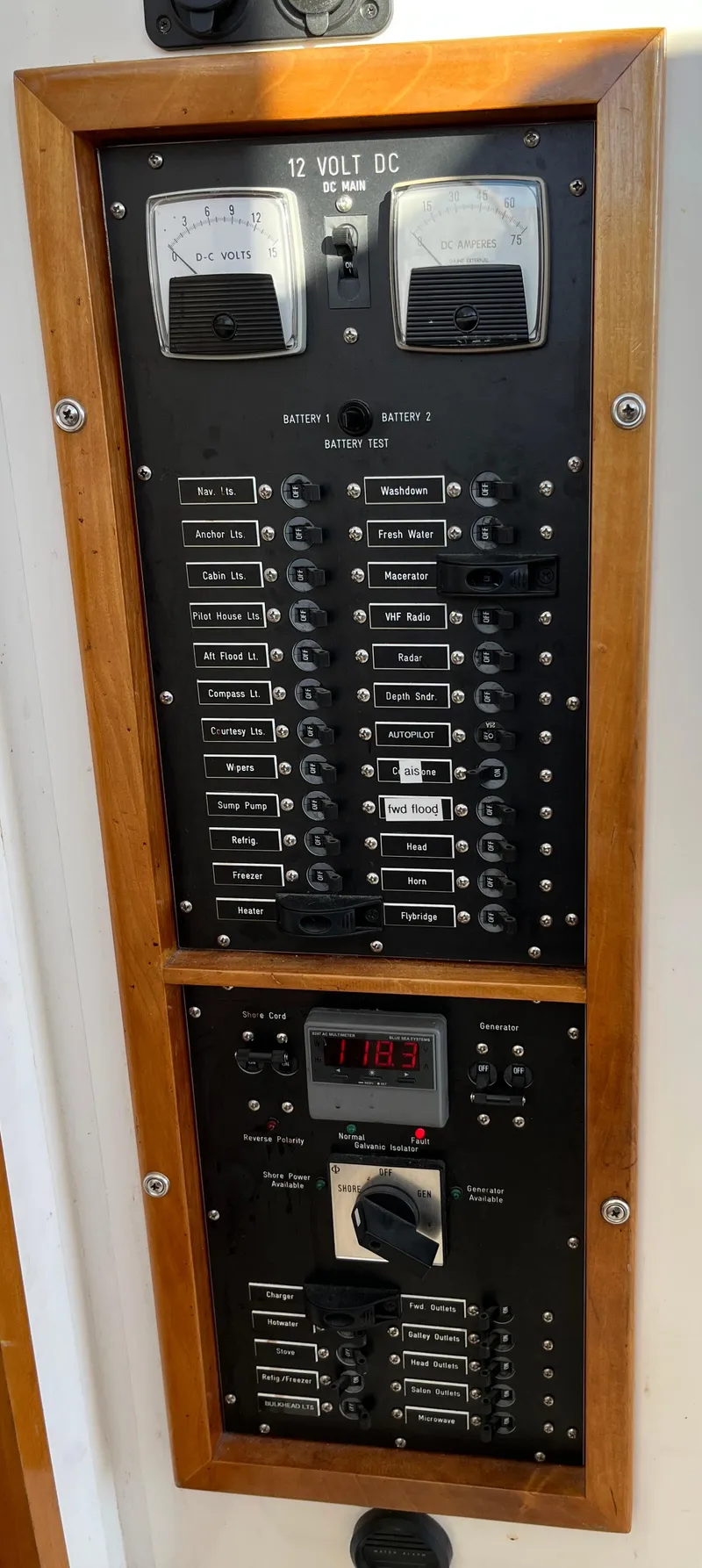 Slide: The Image of Electrical panel of a 2001 Northern Bay 36 boat with wooden frame. - 34