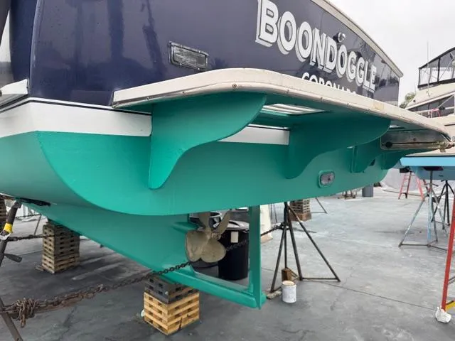 Slide: The Image of 2001 Northern Bay 36 boat named "Boondoggle" on dry dock, showcasing hull and propeller. - 43