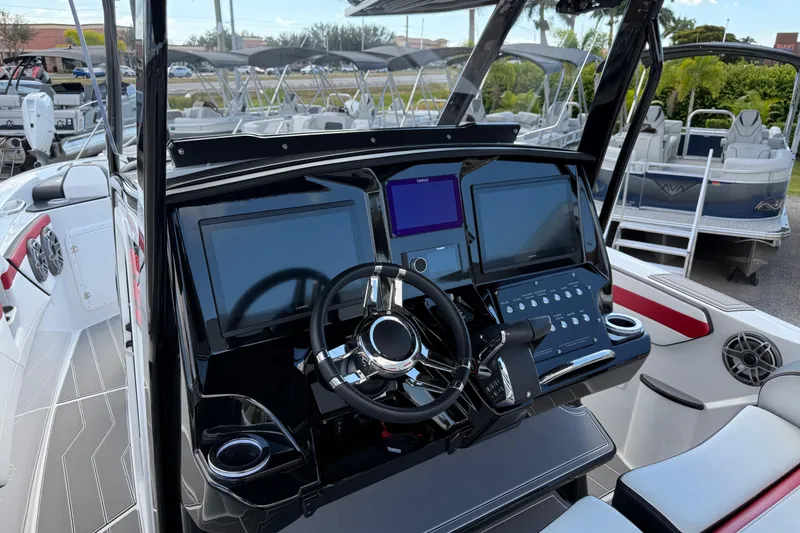 Slide: The Image of 2025 Sunsation 32 CCX boat dashboard with modern controls and dual screens. - 14