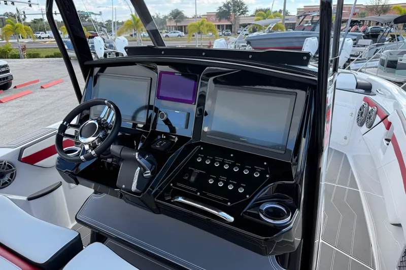 Slide: The Image of 2025 Sunsation 32 CCX boat dashboard with modern controls and sleek design. - 15