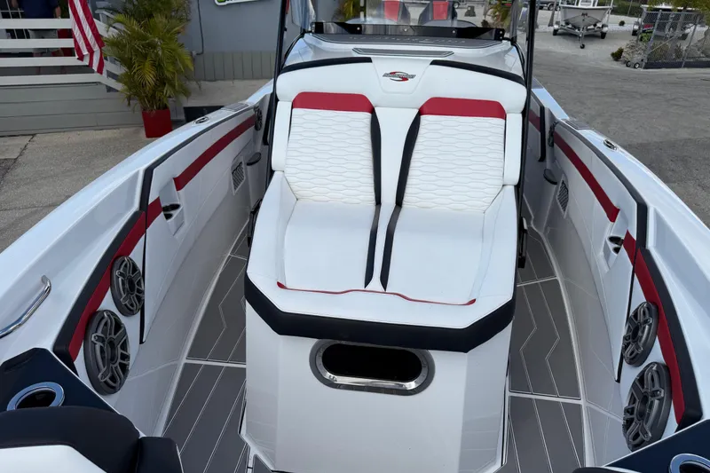 Slide: The Image of 2025 Sunsation 32 CCX boat interior with white and red seating, modern design. - 19