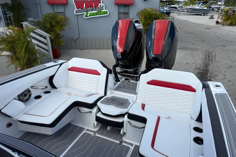 Slide: The Image of 2025 Sunsation 32 CCX boat interior with stylish seating and dual outboard engines. - 24