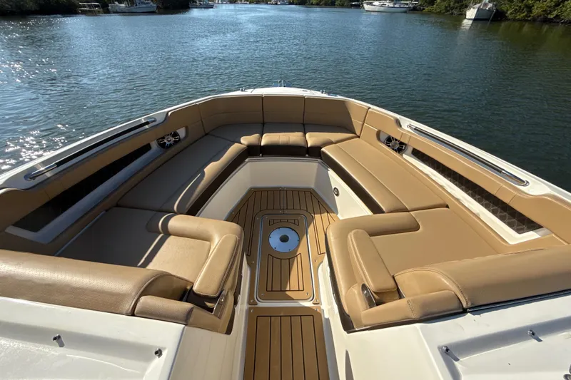 Slide: The Image of Luxurious 2021 Sea Ray SLX 310 Outboard boat interior with spacious seating. - 5