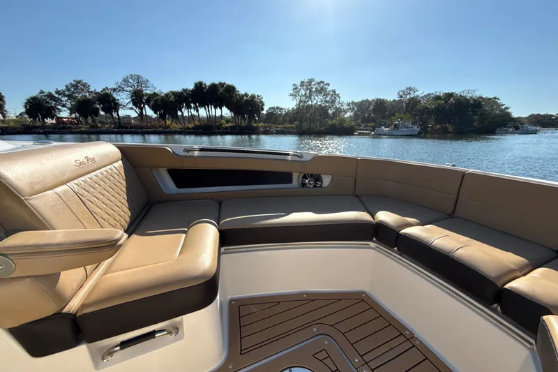 Slide: The Image of Luxurious seating on 2021 Sea Ray SLX 310 Outboard, with scenic water view. - 8