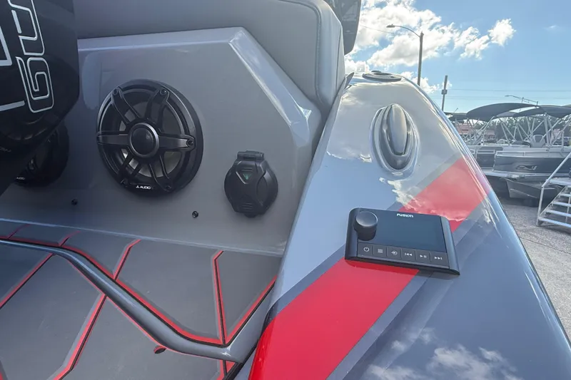 Slide: The Image of 2026 Sunsation 34 CCX boat interior with JL Audio speakers and Fusion control panel. - 12