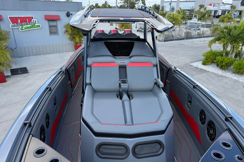 Slide: The Image of 2026 Sunsation 34 CCX boat interior with modern seating and sleek design. - 16