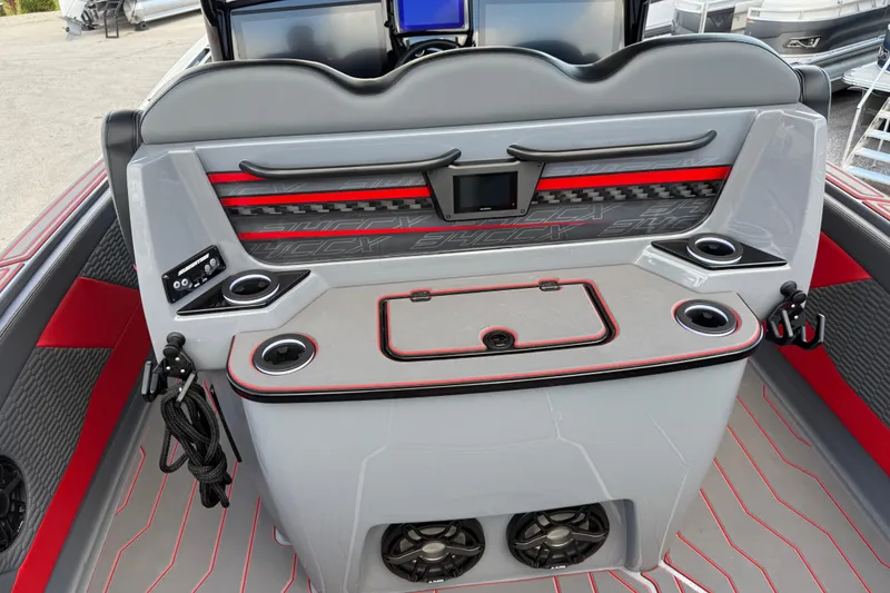 Slide: The Image of 2026 Sunsation 34 CCX boat interior with modern dashboard and cup holders. - 25