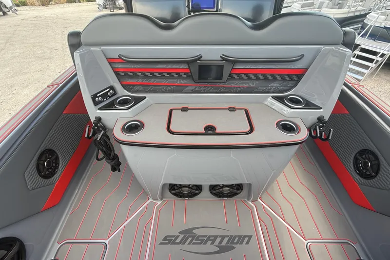 Slide: The Image of 2026 Sunsation 34 CCX boat interior with modern design, featuring cup holders and speakers. - 28