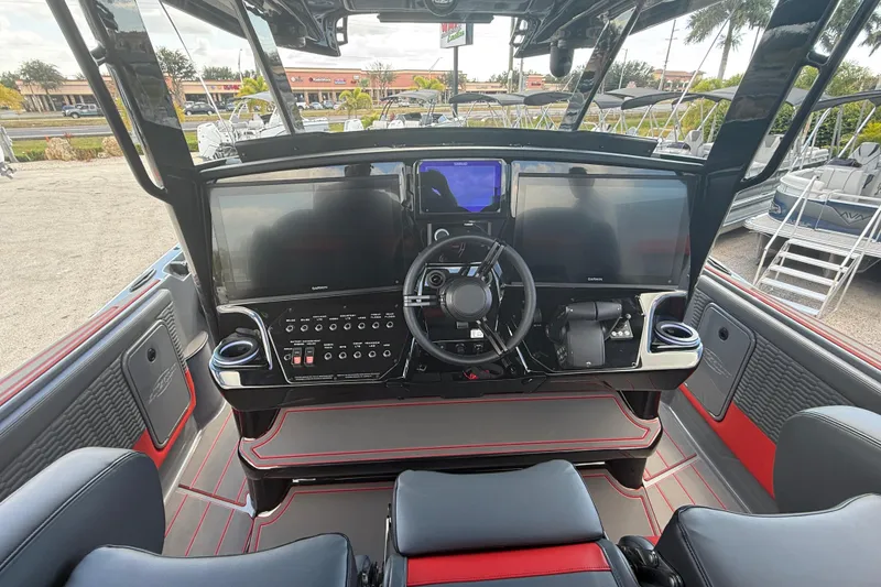 Slide: The Image of 2026 Sunsation 34 CCX boat cockpit with advanced navigation displays and sleek design. - 29