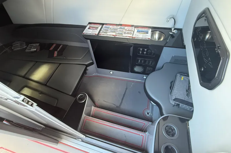 Slide: The Image of Interior of 2026 Sunsation 34 CCX boat with seating, sink, and control panel. - 32