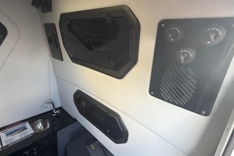 Slide: The Image of Interior of 2026 Sunsation 34 CCX boat featuring control panel and sink. - 34