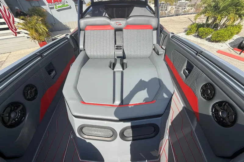 Slide: The Image of 2026 Sunsation 34 CCX boat interior with gray and red seating, speakers, and modern design. - 39