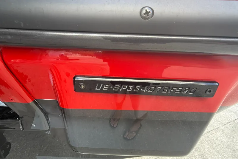 Slide: The Image of 2026 Sunsation 34 CCX boat hull identification number on red and black surface. - 43