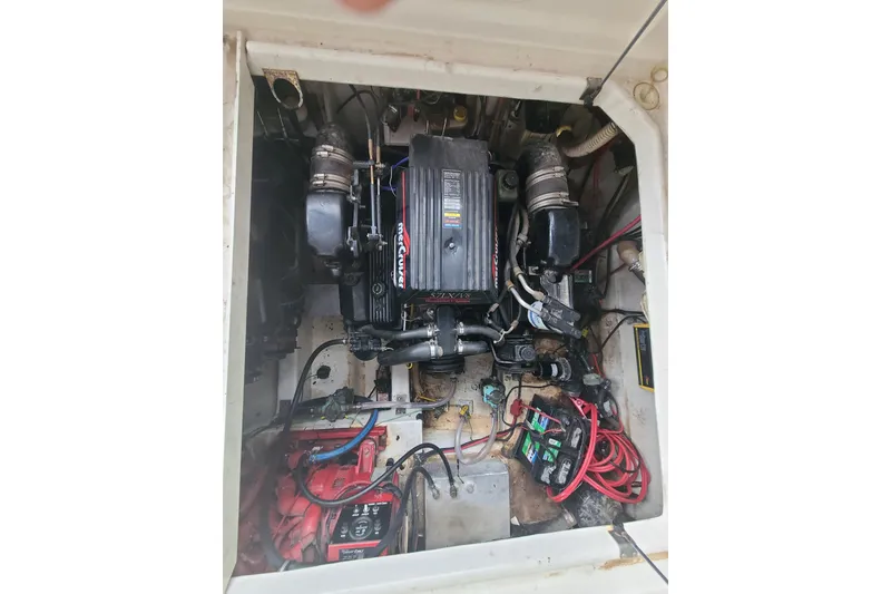 Slide: The Image of Engine compartment of a 1997 Bayliner 3255 Avanti boat, featuring a MerCruiser engine. - 19