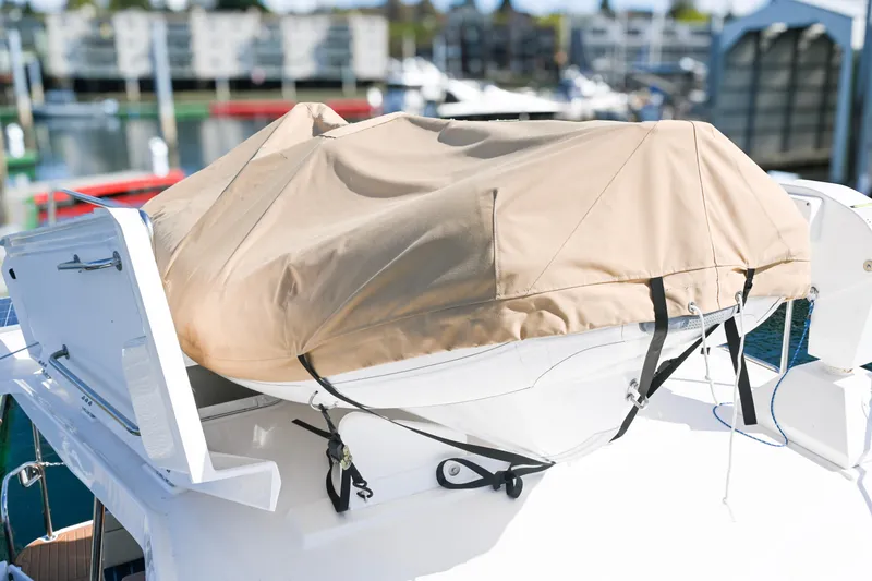 Slide: The Image of Covered boat on a 2022 Ranger Tugs R-43 CB, docked at a marina. - 14