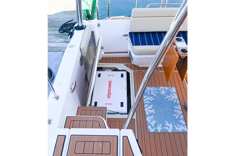 Slide: The Image of 2022 Ranger Tugs R-43 CB boat deck with seating, storage, and marine flooring. - 21