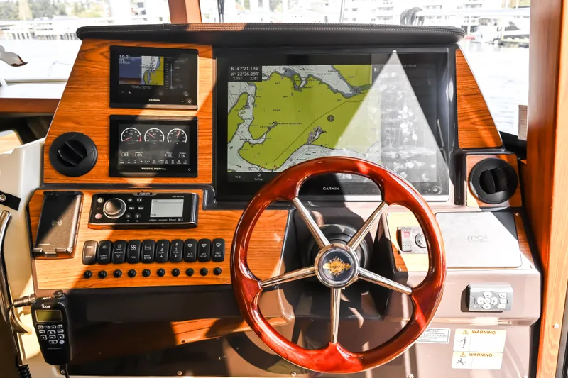 Slide: The Image of 2022 Ranger Tugs R-43 CB helm with Garmin navigation and wood finish. - 37