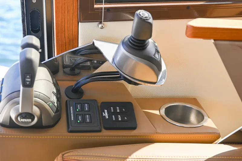 Slide: The Image of Control panel of 2022 Ranger Tugs R-43 CB boat with joystick and throttle. - 39