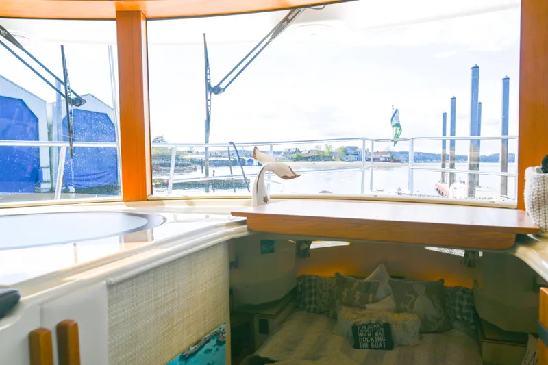 Slide: The Image of Interior view of 2022 Ranger Tugs R-43 CB yacht with cozy cabin and waterfront scenery. - 41