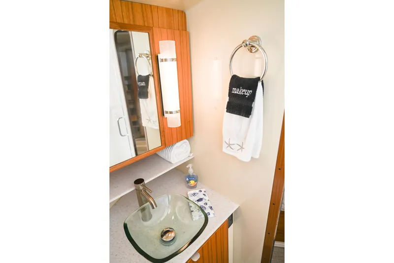 Slide: The Image of Elegant bathroom interior of 2022 Ranger Tugs R-43 CB with modern sink and towels. - 54
