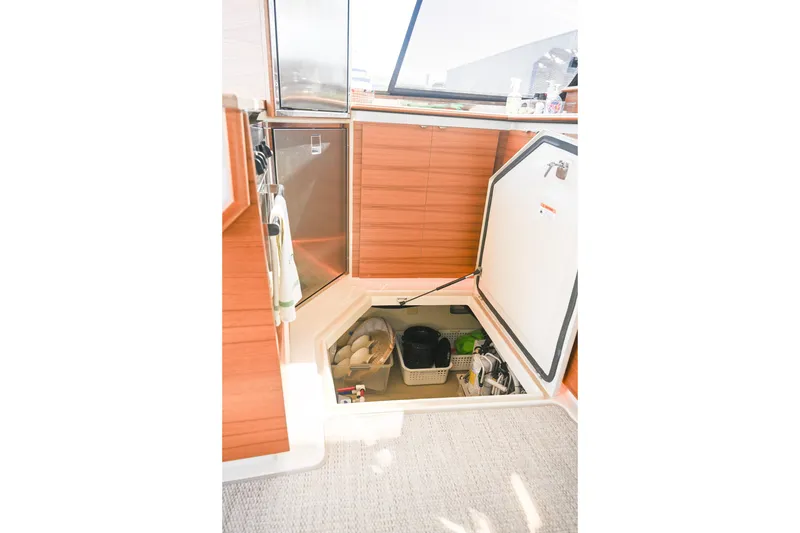 Slide: The Image of Interior storage compartment of 2022 Ranger Tugs R-43 CB boat. - 57