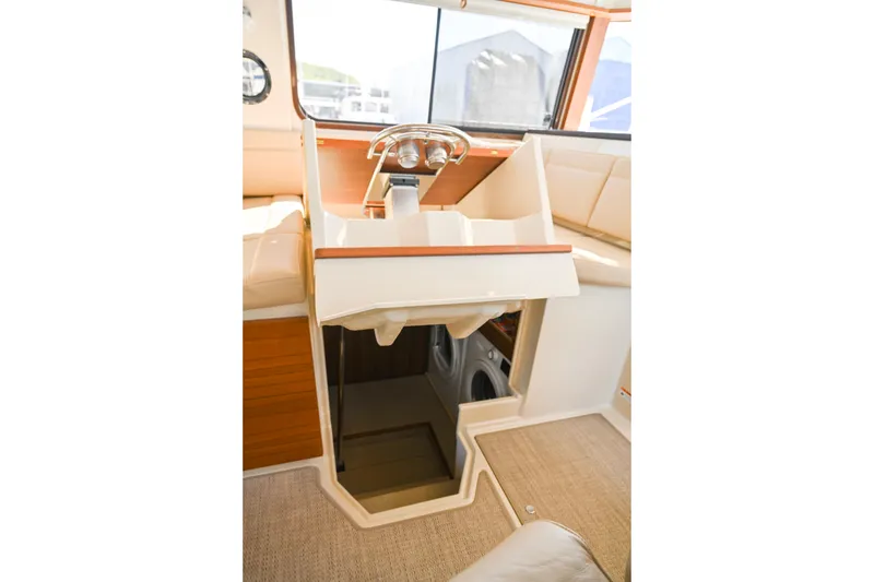 Slide: The Image of Interior view of 2022 Ranger Tugs R-43 CB boat helm and cabin entrance. - 66