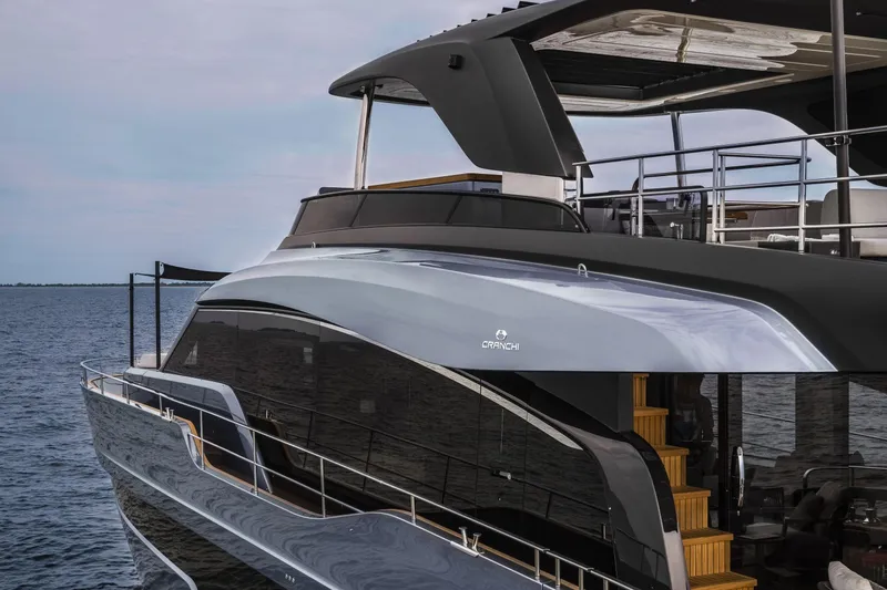 Slide: The Image of 2026 Cranchi Settantotto 78 yacht on water, showcasing sleek design and luxury features. - 15