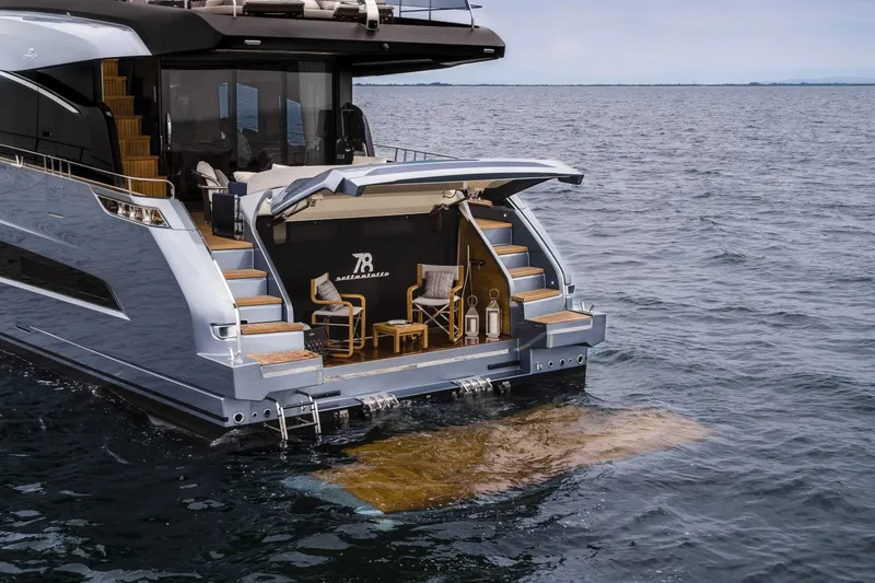 Slide: The Image of 2026 Cranchi Settantotto 78 yacht with elegant rear deck and ocean view. - 17