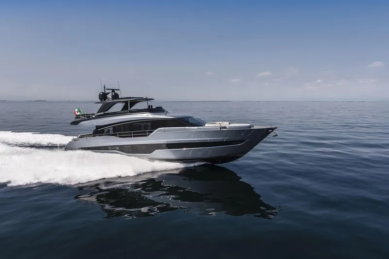 Slide: The Image of 2026 Cranchi Settantotto 78 yacht cruising on calm ocean waters. - 20