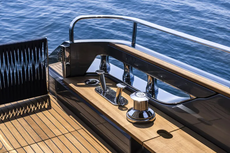 Slide: The Image of Luxury deck of 2026 Cranchi Settantotto 78 yacht with polished wood and chrome details. - 43