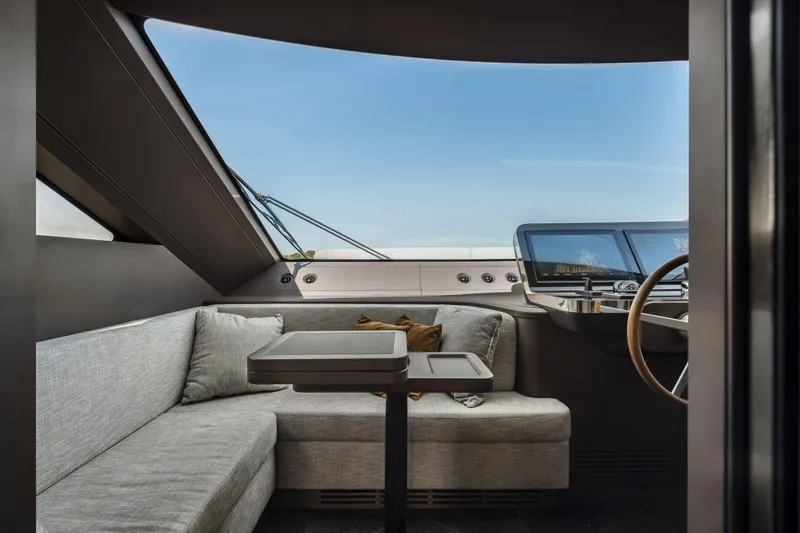 Slide: The Image of Luxurious interior of 2026 Cranchi Settantotto 78 yacht with modern seating and helm. - 45