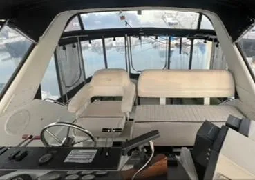 Slide: The Image of 1991 Carver 33 Aft Cabin Motor Yacht with black canvas enclosure. - 4