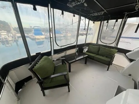 Slide: The Image of 1991 Carver 33 Aft Cabin Motor Yacht docked at marina, top view. - 7