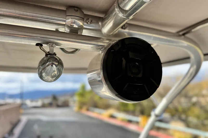 Slide: The Image of Close-up of a 2001 Sea Ray 240 Sundeck's speaker and light fixture. - 14