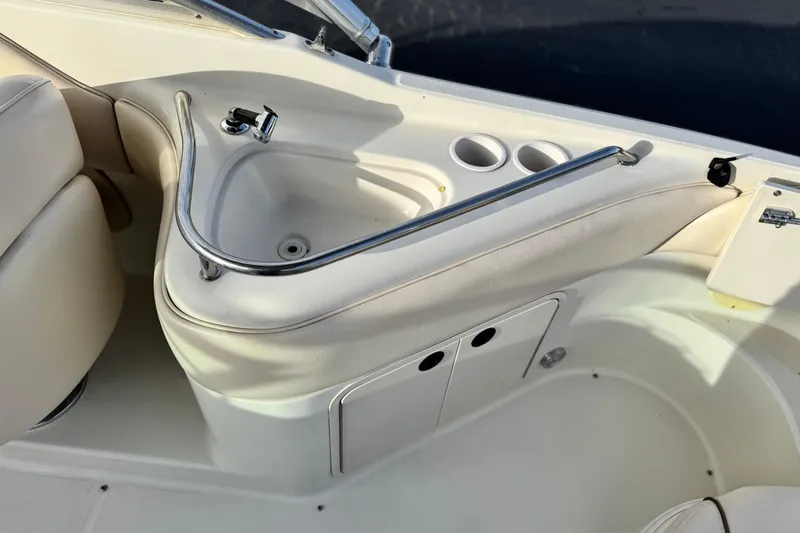 Slide: The Image of Interior of 2001 Sea Ray 240 Sundeck boat with sink and cup holders. - 26