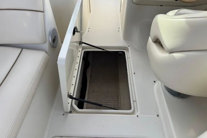Slide: The Image of Open storage compartment on 2001 Sea Ray 240 Sundeck boat interior. - 30