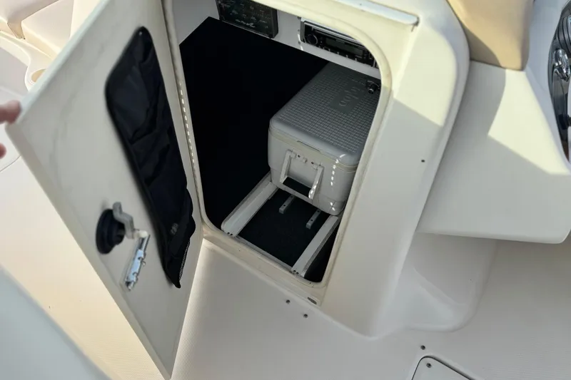 Slide: The Image of Storage compartment on a 2001 Sea Ray 240 Sundeck boat with cooler inside. - 35