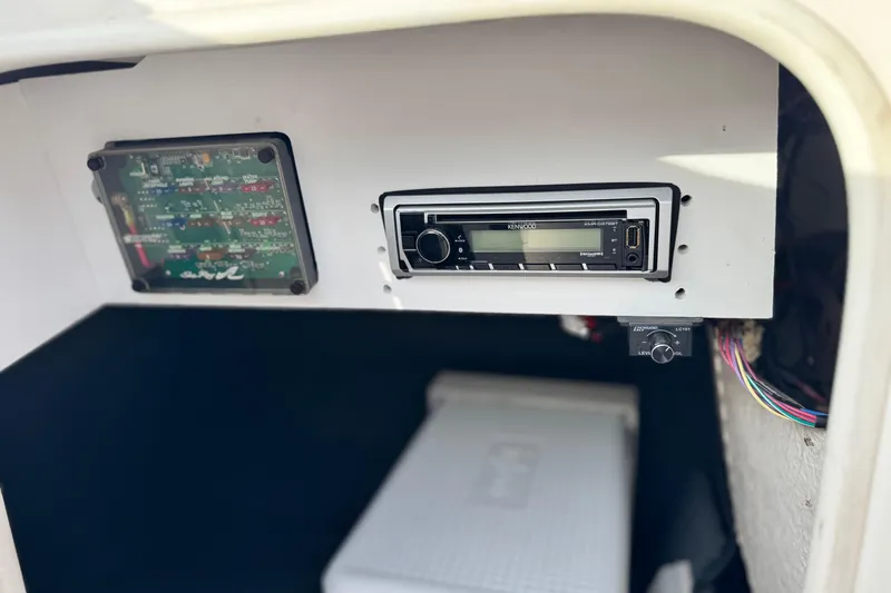 Slide: The Image of 2001 Sea Ray 240 Sundeck interior with Kenwood stereo and control panel. - 36