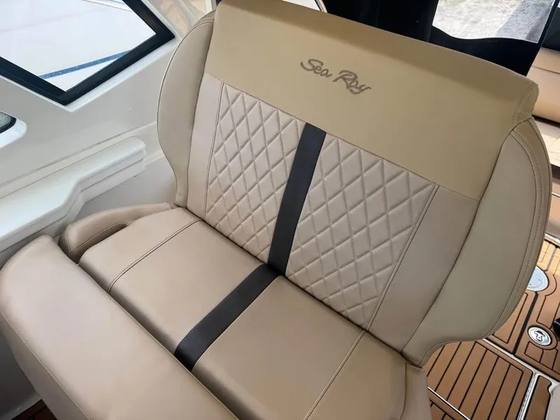 Slide: The Image of 2017 Sea Ray Sundancer 350 Coupe beige leather seat with diamond stitching. - 11