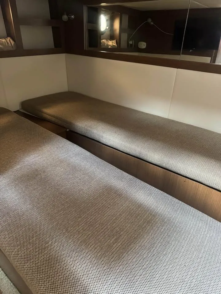 Slide: The Image of Interior cabin of 2017 Sea Ray Sundancer 350 Coupe with twin beds. - 17