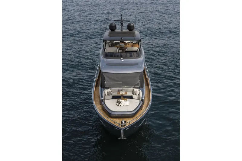 Slide: The Image of 2026 Cranchi Settantotto 78 yacht on open water, showcasing luxury design and spacious deck. - 13