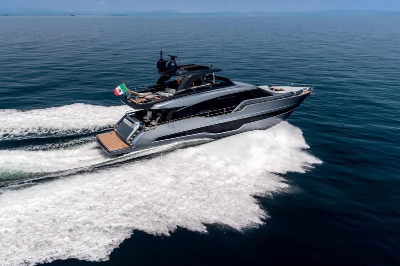 Slide: The Image of 2026 Cranchi Settantotto 78 yacht cruising on open sea, rear view. - 19
