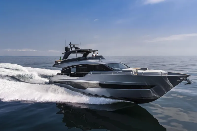 Slide: The Image of 2026 Cranchi Settantotto 78 yacht cruising on open water under clear skies. - 4