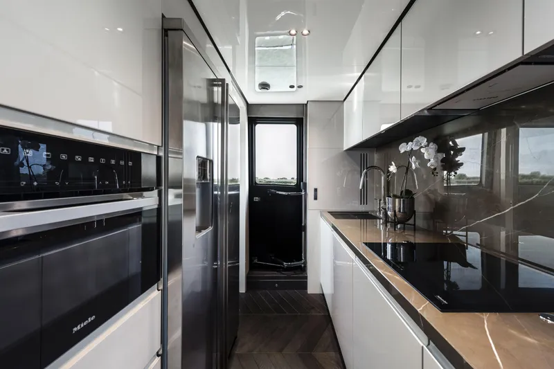 Slide: The Image of Luxurious kitchen interior of 2026 Cranchi Settantotto 78 yacht with modern appliances. - 46