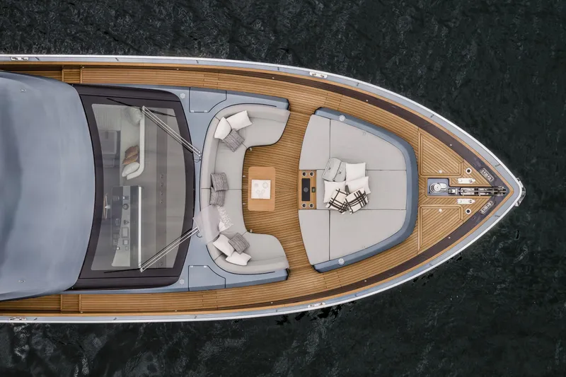 Slide: The Image of Aerial view of 2026 Cranchi Settantotto 78 yacht's elegant deck with seating area. - 5